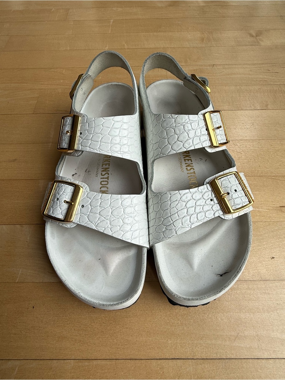 Birkenstock Women’s White Buckle Sandals with Gold Accents